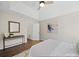 Cozy bedroom featuring wood floors, neutral paint, and direct access to another room at 4101 New Castle Ln, Monroe, NC 28110