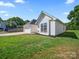 Charming home featuring attached garage, manicured lawn, and architectural details at 4101 New Castle Ln, Monroe, NC 28110