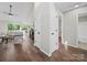 Bright foyer boasts hardwood floors, neutral walls, and flows into a living area at 4101 New Castle Ln, Monroe, NC 28110