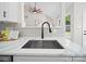 Beautiful kitchen sink showcasing quartz countertops and modern fixtures at 4101 New Castle Ln, Monroe, NC 28110