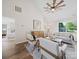 Bright living room with vaulted ceiling, modern ceiling fan, and cozy seating at 4101 New Castle Ln, Monroe, NC 28110
