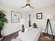 Well-lit home office featuring a modern desk, art, and a window for natural light at 4101 New Castle Ln, Monroe, NC 28110