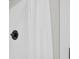 A clean shower boasts a new shower head fixture and white tiled walls at 4101 New Castle Ln, Monroe, NC 28110