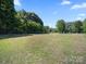 Expansive yard with mature trees, ideal for outdoor activities and relaxation at 4101 New Castle Ln, Monroe, NC 28110