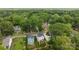 An aerial view of the property highlighting the surrounding neighborhood and mature trees at 414 King St, Waxhaw, NC 28173