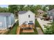 View of the backyard featuring a wooden deck with comfortable outdoor seating and a well-maintained lawn at 414 King St, Waxhaw, NC 28173