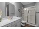 Modern bathroom with a sleek vanity, glass-enclosed shower, and contemporary fixtures at 414 King St, Waxhaw, NC 28173