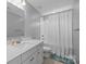 Bright bathroom with white vanity, shower-tub combo, and tile flooring at 414 King St, Waxhaw, NC 28173