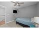 Bedroom featuring carpet, tv, window, and ceiling fan at 414 King St, Waxhaw, NC 28173