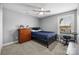 Bedroom featuring neutral walls, a ceiling fan, and a large window at 414 King St, Waxhaw, NC 28173