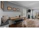 Dining area with wainscoting, built-in bench and bench seating, plus a fireplace and large windows at 414 King St, Waxhaw, NC 28173