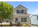 Charming two-story home featuring a welcoming front porch and well-maintained landscaping at 414 King St, Waxhaw, NC 28173