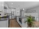 Well-equipped kitchen featuring modern appliances, a center island, and a breakfast nook at 414 King St, Waxhaw, NC 28173