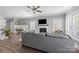 Bright living room featuring a fireplace, hardwood floors, and neutral paint at 414 King St, Waxhaw, NC 28173