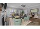 Spacious living room with fireplace, plantation shutters, and a comfortable gray sectional at 414 King St, Waxhaw, NC 28173