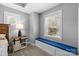 Bedroom area with a window seat, side table, and ample natural light at 414 King St, Waxhaw, NC 28173