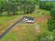 Aerial view of a house with a circular driveway surrounded by lush greenery at 456 Rainbow Cir, Clover, SC 29710