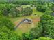 Aerial view of a charming house surrounded by trees and countryside landscape at 456 Rainbow Cir, Clover, SC 29710