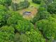 Secluded home on expansive lot, featuring a long driveway and mature trees for privacy at 456 Rainbow Cir, Clover, SC 29710