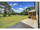 Spacious backyard featuring a large lawn, patio, shed, and covered porch at 456 Rainbow Cir, Clover, SC 29710