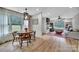 Dining room with a rustic table set and large windows overlooking the outdoor scenery at 456 Rainbow Cir, Clover, SC 29710