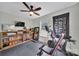 Home gym featuring a ceiling fan, exercise equipment, a mirror, and wood flooring at 456 Rainbow Cir, Clover, SC 29710