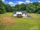 Exterior elevation featuring a front porch and expansive lawn at 456 Rainbow Cir, Clover, SC 29710