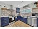 This kitchen features eye-catching tile, stainless appliances, and stainless farm sink at 456 Rainbow Cir, Clover, SC 29710