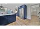 Open kitchen with stainless steel refrigerator, quartz countertop, and view to living room at 456 Rainbow Cir, Clover, SC 29710