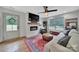 Inviting living room with fireplace, large windows, and stylish decor at 456 Rainbow Cir, Clover, SC 29710
