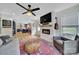 Open living room with fireplace, adjacent to the kitchen and filled with natural light at 456 Rainbow Cir, Clover, SC 29710