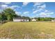 Spacious backyard, partially fenced in, showcasing the home's rear exterior and surrounding landscape at 4751 Kemp Dellinger Rd, Maiden, NC 28650
