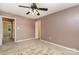 Spacious bedroom featuring a ceiling fan and neutral colored walls and carpet at 4751 Kemp Dellinger Rd, Maiden, NC 28650