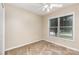 Bedroom features a bright ceiling fan, neutral walls and carpet, and a window for natural light at 4751 Kemp Dellinger Rd, Maiden, NC 28650