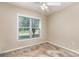 Bedroom with neutral walls, a ceiling fan, and a large window letting in natural light at 4751 Kemp Dellinger Rd, Maiden, NC 28650