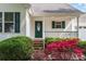 Home featuring a green front door framed by beautiful landscaping and colorful flowering bushes at 4751 Kemp Dellinger Rd, Maiden, NC 28650