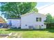 Well-maintained backyard with lush grass, a patio, and a garden area at 4838 Holbrook Dr, Charlotte, NC 28212