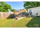 Backyard with patio area featuring a picnic table and shade sails at 4838 Holbrook Dr, Charlotte, NC 28212