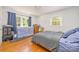 Bedroom showcasing hardwood floors, natural light, and ample space at 4838 Holbrook Dr, Charlotte, NC 28212