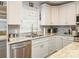 Bright kitchen featuring white cabinets, granite countertops, and stainless steel appliances at 4838 Holbrook Dr, Charlotte, NC 28212