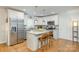 Modern kitchen features stainless steel appliances and a large island with bar seating at 4838 Holbrook Dr, Charlotte, NC 28212