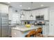 Bright kitchen featuring white cabinets, granite countertops, and stainless steel appliances at 4838 Holbrook Dr, Charlotte, NC 28212