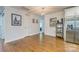Open living area with hardwood floors, modern lighting, and neutral wall color at 4838 Holbrook Dr, Charlotte, NC 28212