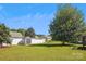 Well-maintained backyard with a storage shed, lush green grass, privacy fence, and mature trees on a sunny day at 5018 Drake Pond Ln, Rock Hill, SC 29732