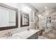 Modern bathroom with a double sink vanity, a tiled shower with a bench, and stylish fixtures at 5018 Drake Pond Ln, Rock Hill, SC 29732