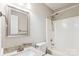 Bright bathroom with a granite vanity, modern fixtures, a new white toilet, and shower with bathtub at 5018 Drake Pond Ln, Rock Hill, SC 29732