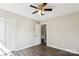 Comfortable bedroom with gray vinyl floors, a ceiling fan, and a closet near the entry doorway at 5018 Drake Pond Ln, Rock Hill, SC 29732