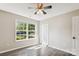 Cozy bedroom with a ceiling fan, closet, and a large window providing natural light at 5018 Drake Pond Ln, Rock Hill, SC 29732