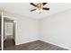 Neutral bedroom with gray flooring, ceiling fan, and two electrical outlets at 5018 Drake Pond Ln, Rock Hill, SC 29732
