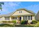 Charming home with a welcoming front porch, manicured landscaping, and classic black shutters at 5018 Drake Pond Ln, Rock Hill, SC 29732